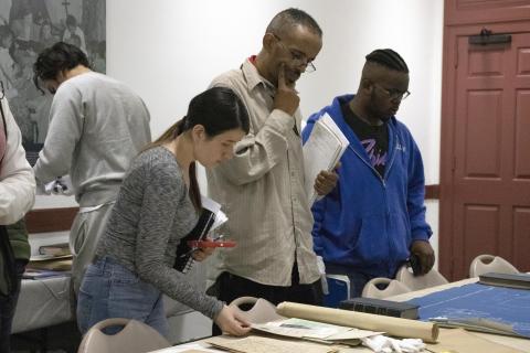 Students looking at archival material