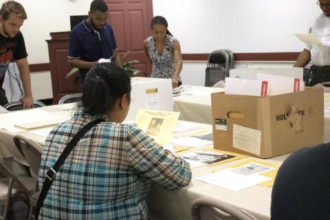 Students looking at archival material