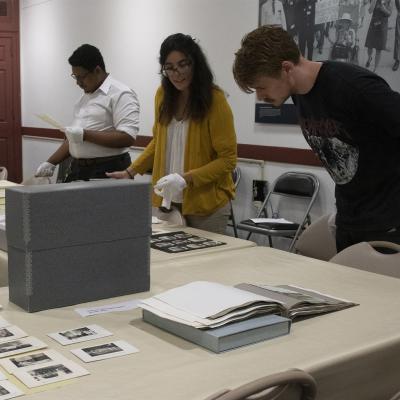 Students looking at items