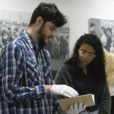 Students holding document